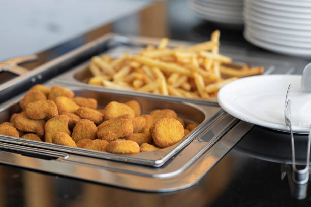 fried chicken and french fries in a hotel buffet