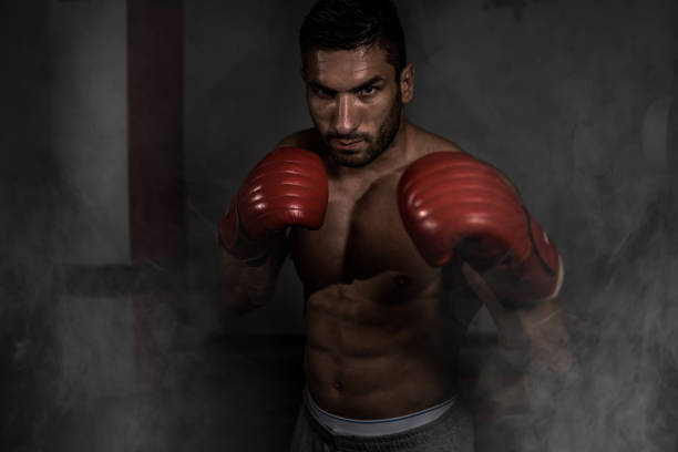 istock Portrait of a young boxer, kick boxer ready for training 1272829404