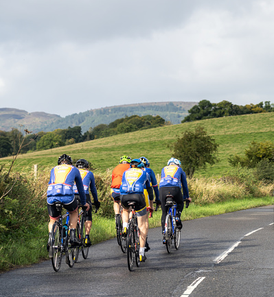 Trossachs, Scotland - A group of road cyclists training on a country road in the West of Scotland.