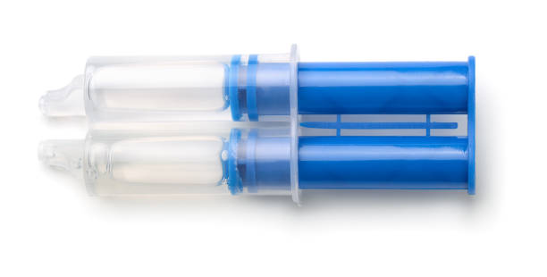 Top view of epoxy resin syringe Top view of epoxy resin syringe isolated on white hardener stock pictures, royalty-free photos & images