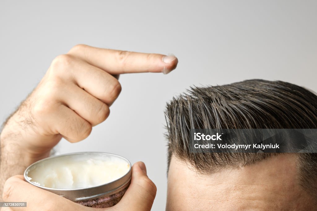 Man Applying A Clay Pomade Wax Gel Or Mousse From Round Metal Box For  Styling His Hair After Barbershop Hair Cut Advertising Concept Of Mans  Products Treatment And Care Against Lost Of