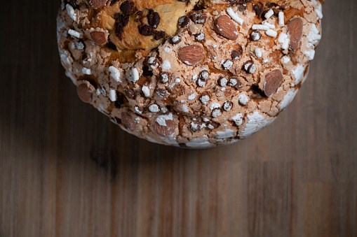 Traditional Italian homemade Christmas panettone typical of Milan with almonds, chocolate drops and sugar
