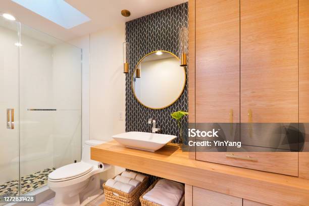 Contemporary Bathroom Design With Above Counter Vessel Sink And Vanity Glass Shower Stall And Toilet Stock Photo - Download Image Now
