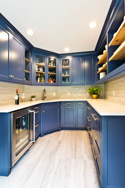 Remodeled Contemporary Bar Pantry Room A contemporary bar kitchen pantry room renovation remodeling featuring wine storage cabinet, bar sink and various pantry storage bar cabinet stock pictures, royalty-free photos & images