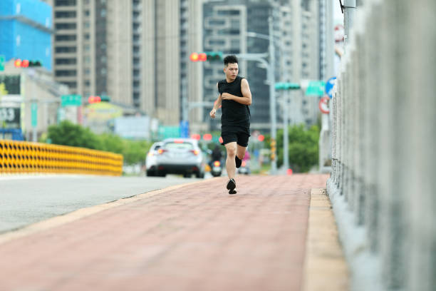 istock Man running and exercising in the city 1272832324