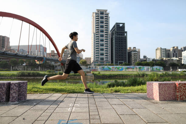 istock Man running and exercising in the city 1272832375