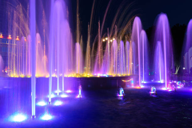 istock Jets of a night multi-colored illuminated fountain close-up 1272837018