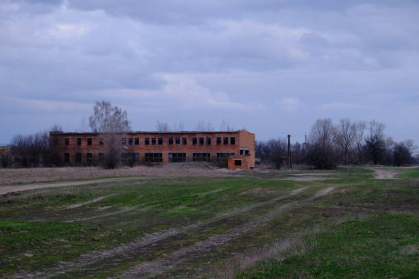 istock An abandoned two-story brick building. Cloudy evening landscape. Cloudy sky. 1272838456