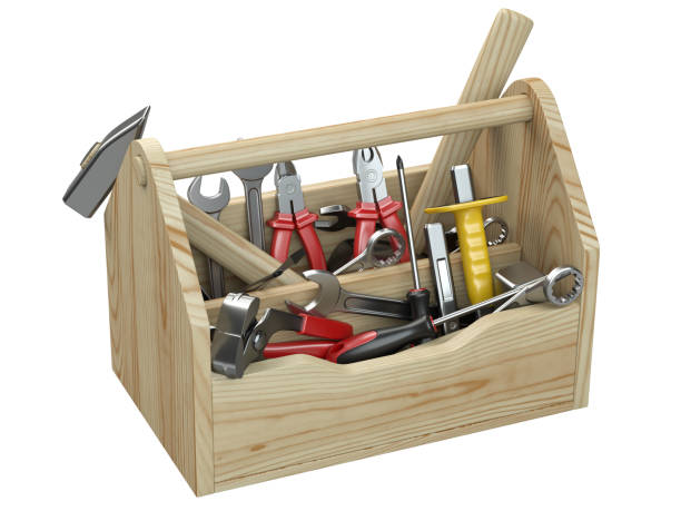 istock Wooden box for your toolbox. Next to which is an ax, a chisel, a chisel, pliers, a mallet, a hammer, a screwdriver, a wrench, a saw and nippers. 1272839094