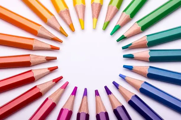 A colour wheel displays colour hues in the shape of a circle. So the relationships between primary colours, secondary colours, tertiary colours and so on can easily be seen. In this image the colour wheels is created from a group of colour pencils.