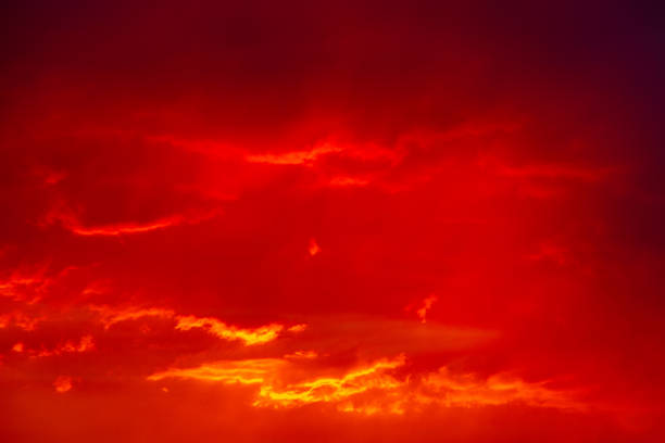 istock Red cloudy sky reflection the last rays of day 1272841530