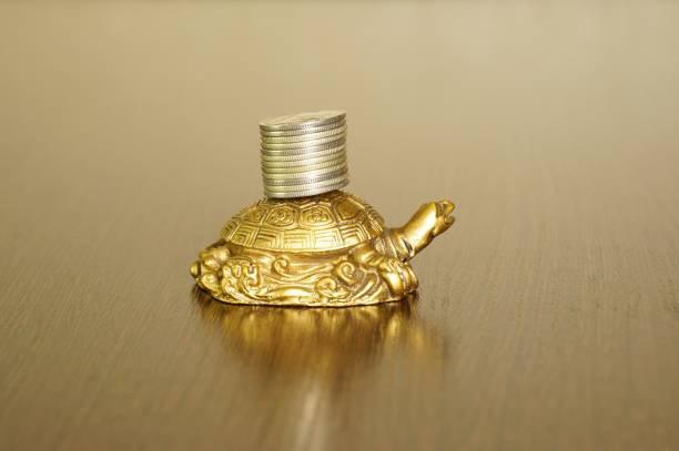 Wooden turtle with Hawaiian carved traditional tribal motifs.