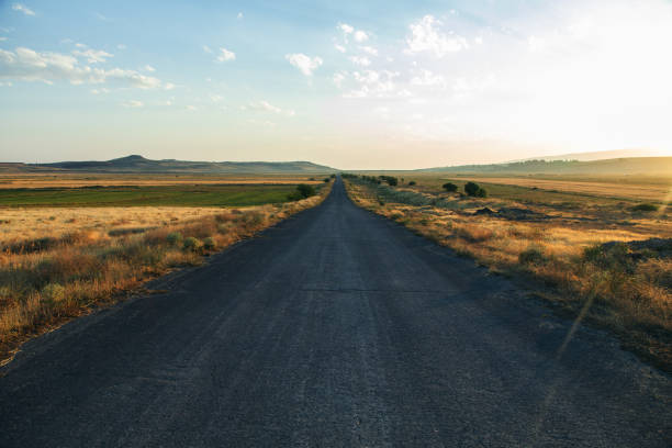 istock asphalt road and field 1272842891