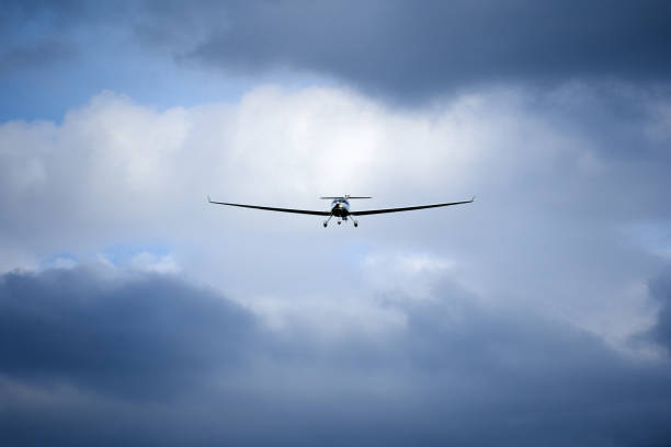 istock Landing approach of a small airplane, dramatic sky with dark clouds. Germany, Stuttgart. 1272844338