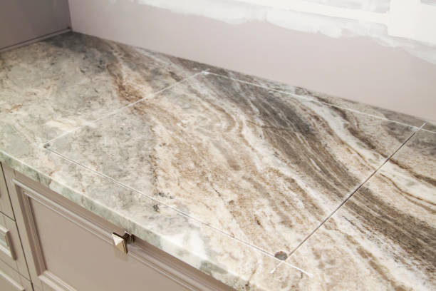marble countertop with prepared incision for cooktop hob during renovation in modern kitchen stock photo