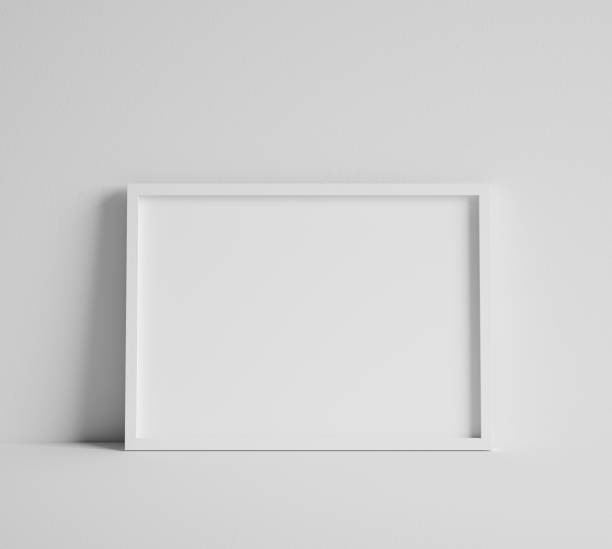 Mock up poster with white frame close up near wall
