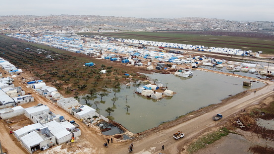 refugees who fled to the border with Turkey near the Syrian war.