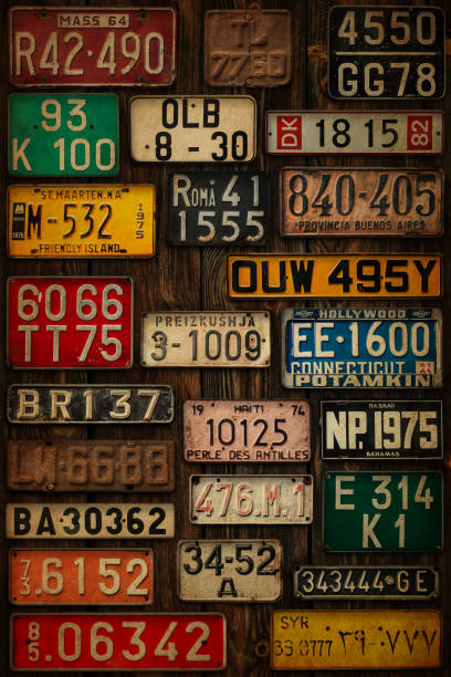 istock Licence Plates on Wooden Wall Vertical 1272857536