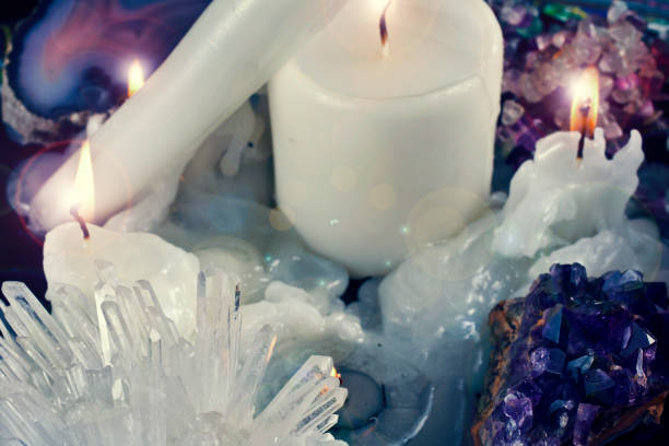 istock Candles with gemstones and crystals 1272858401