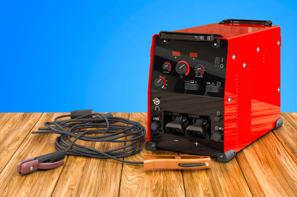 istock Welding machine with stick electrode holder, work cable and clamp on the wooden table. 3D rendering 1272859339