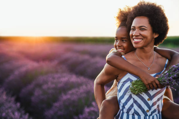 t's a happy vibe at the lavender field today Afro mother and her daughter bonding together outdoors at the lavender field beautiful older black woman stock pictures, royalty-free photos & images