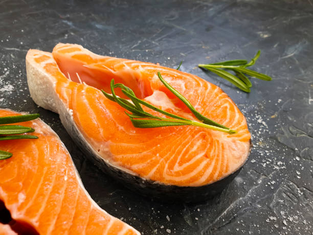 istock fresh red fish rosemary on concrete background 1272864523