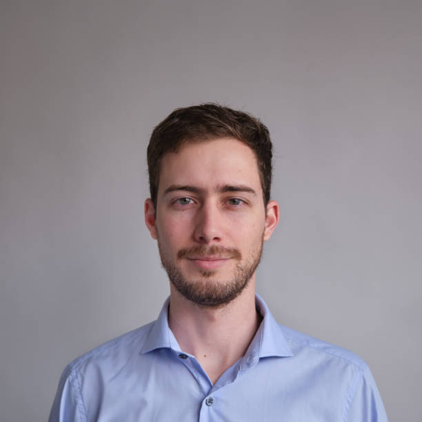 istock passport photo of cute and well dressed Caucasian man 1272864708