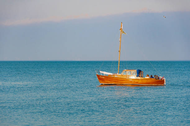 Old wooden vintage boat on the lagoon in Nida, Lithuania