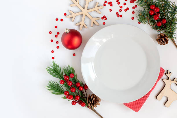 istock White clean round plate, on a white table with Christmas decorations 1272870680