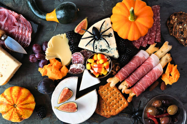 istock Halloween theme charcuterie platter. Top view table scene against a black stone background. 1272870727