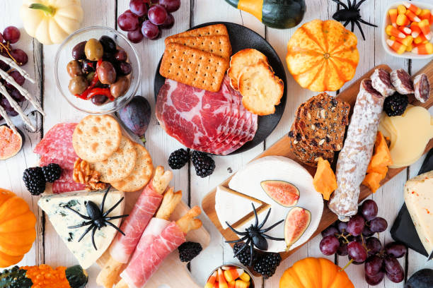 istock Halloween charcuterie overhead table scene against a white wood background 1272871452