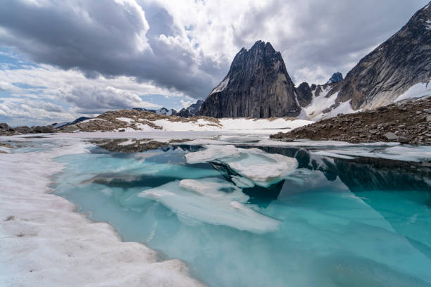 Bugaboo spire mountain and glacier lake with reflection, part of Bugaboos provincial park, one of the most iconic mountains in the area