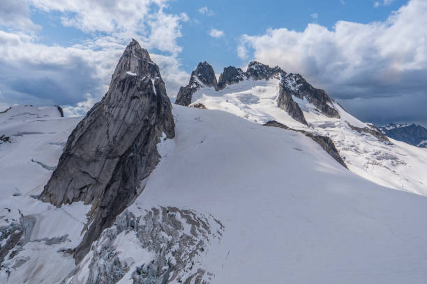 istock Bugaboos national park mountain range on cloudy day with beautiful snow cover and glacier view in British Columbia, Canada 1272872597