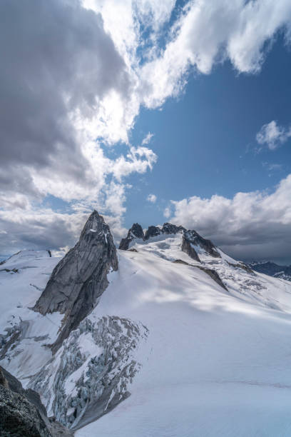 istock Bugaboos national park mountain range on cloudy day with beautiful snow cover and glacier view in British Columbia, Canada 1272872652