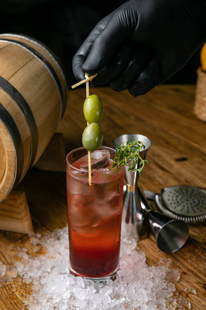 istock Alcoholic cocktail with ice, olives 1272874712