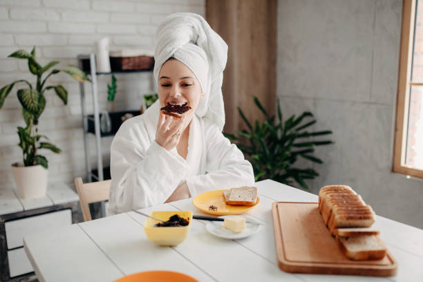 istock Beautiful woman has breakfast at home 1272874957