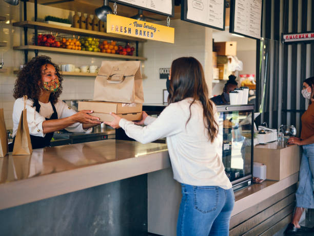 istock Picking Up Take Out Food in a Cafe 1272877913