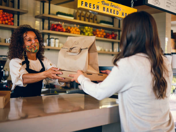 istock Picking Up Take Out Food in a Cafe 1272877942