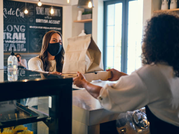istock Picking Up Take Out Food in a Cafe 1272877976