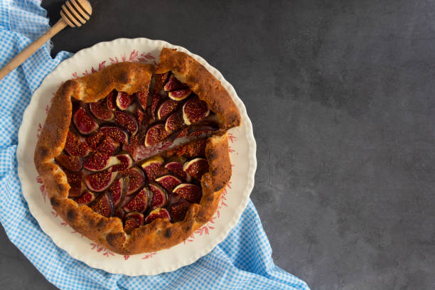 istock Figs galette with fresh figs. Traditional rustic fruit homemade pie, top view. Copy space. 1272878945