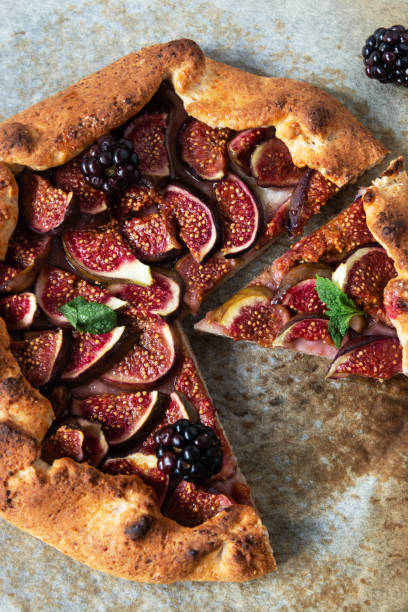 istock Figs galette with fresh figs. Traditional rustic fruit homemade pie, top view. 1272878946