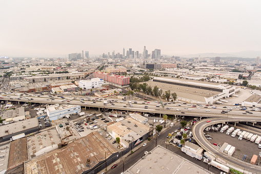 Aerial photo by DJI Phantom 4 over LA Downtown including freeway 10 and manufacture industry