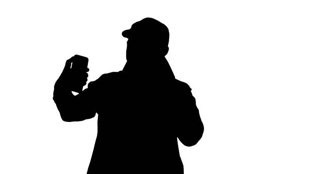 istock Silhouette Young adult man handsome taking selfie 1272883562