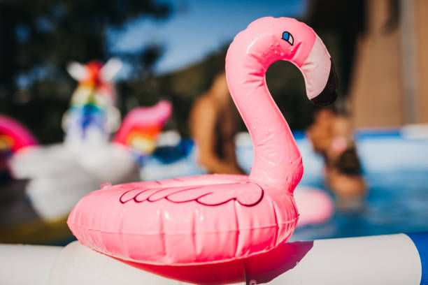istock Beautiful Family Having Fun in the pool 1272884319