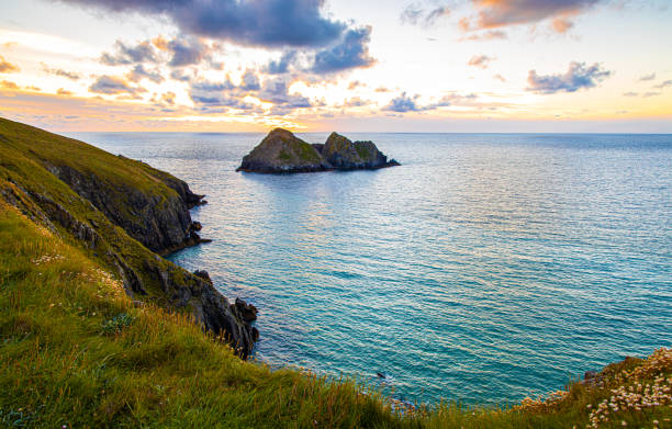 istock Gull rocks at sunset in Hollywell Bay in Cornwall, UK 1272885185