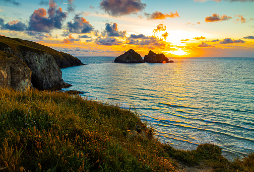 Gull rocks at sunset in Hollywell Bay in Cornwall, UK