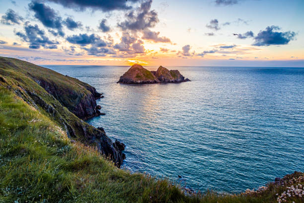 istock Gull rocks at sunset in Hollywell Bay in Cornwall, UK 1272885306