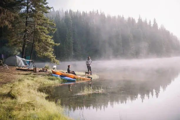 Photo of Man And A Woman Are Fishing At The Mountains