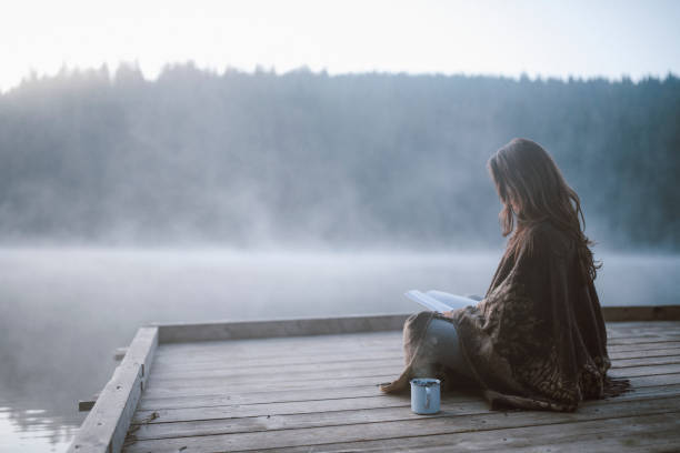 istock Woman Reading Book In Nature. 1272890179