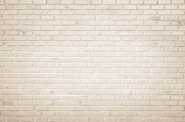 istock Empty Background of wide cream brick wall texture. Old brown brick wall concrete or stone pattern nature, wallpaper limestone abstract floor/Grid uneven interior rock. Home & office design backdrop. 1272890690
